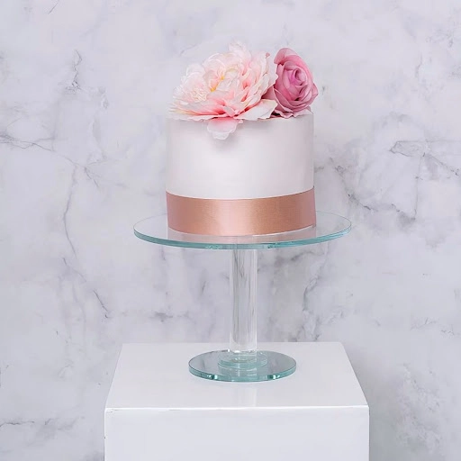 An image of a cake on stand.